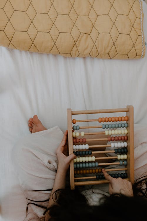 Free Person Holding an Abacus Stock Photo