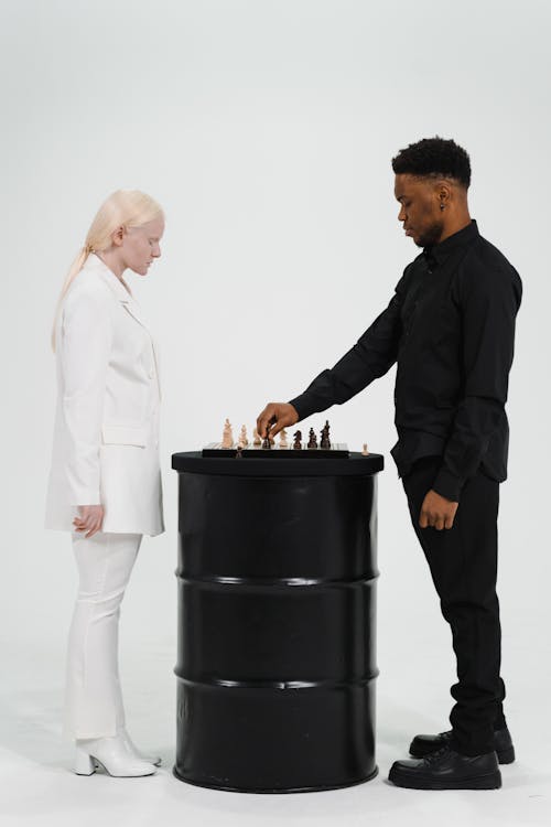 Man and Woman Playing Chess