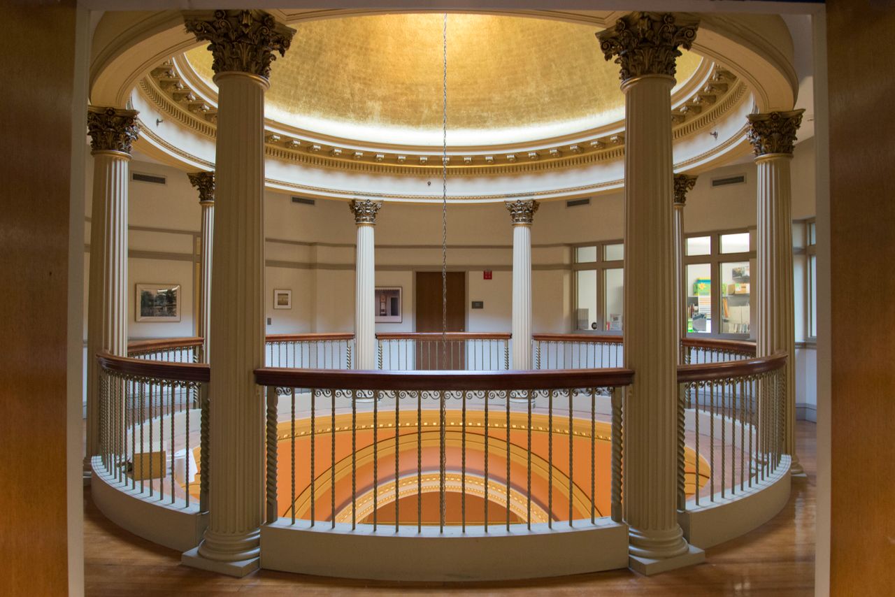 classic architectural interior featuring a dome with decorative pillar