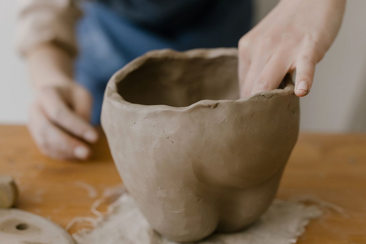 Clay being shaped by hand for a ceramic piece