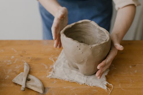 

A Close-Up Shot of A Person Doing Pottery