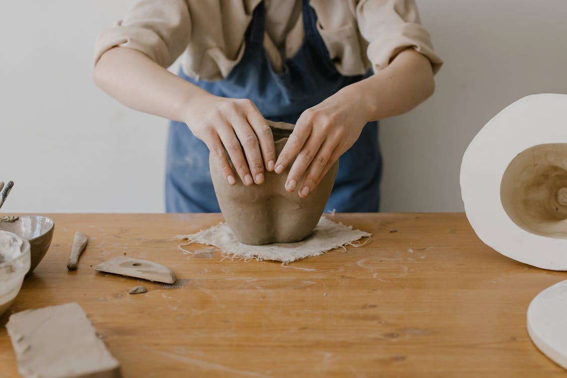 Hands of a Person Molding Clay · Free Stock Photo