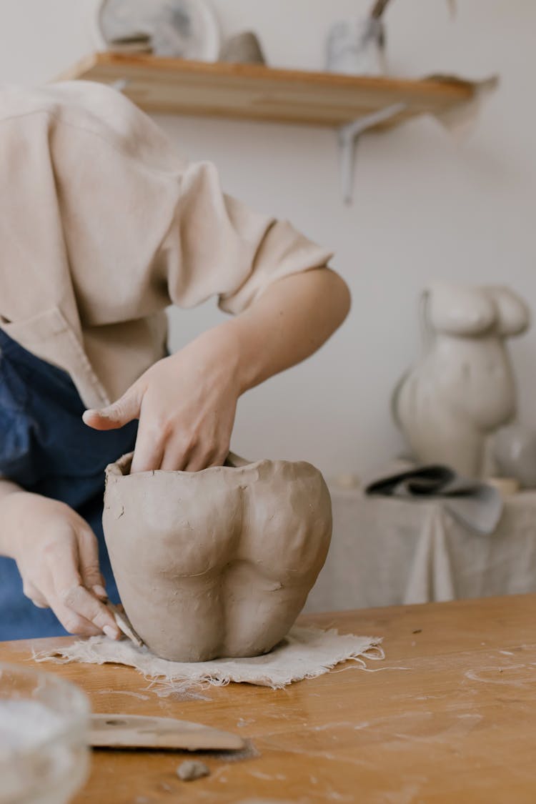 Person Molding A Clay Pot