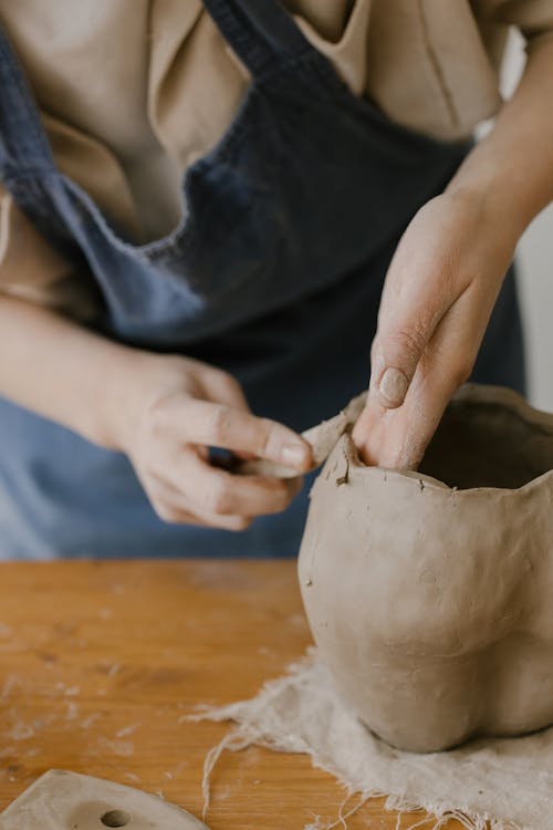 Free Person Sculpting a Clay Pot Stock Photo