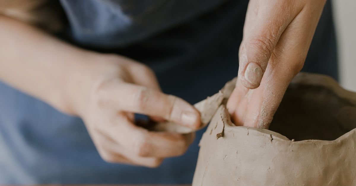 Person Using Clay Person Sculpting a Clay Pot · Free Stock Photo