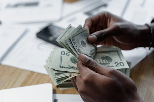 Free Hands of a Person Counting Cash Money Stock Photo