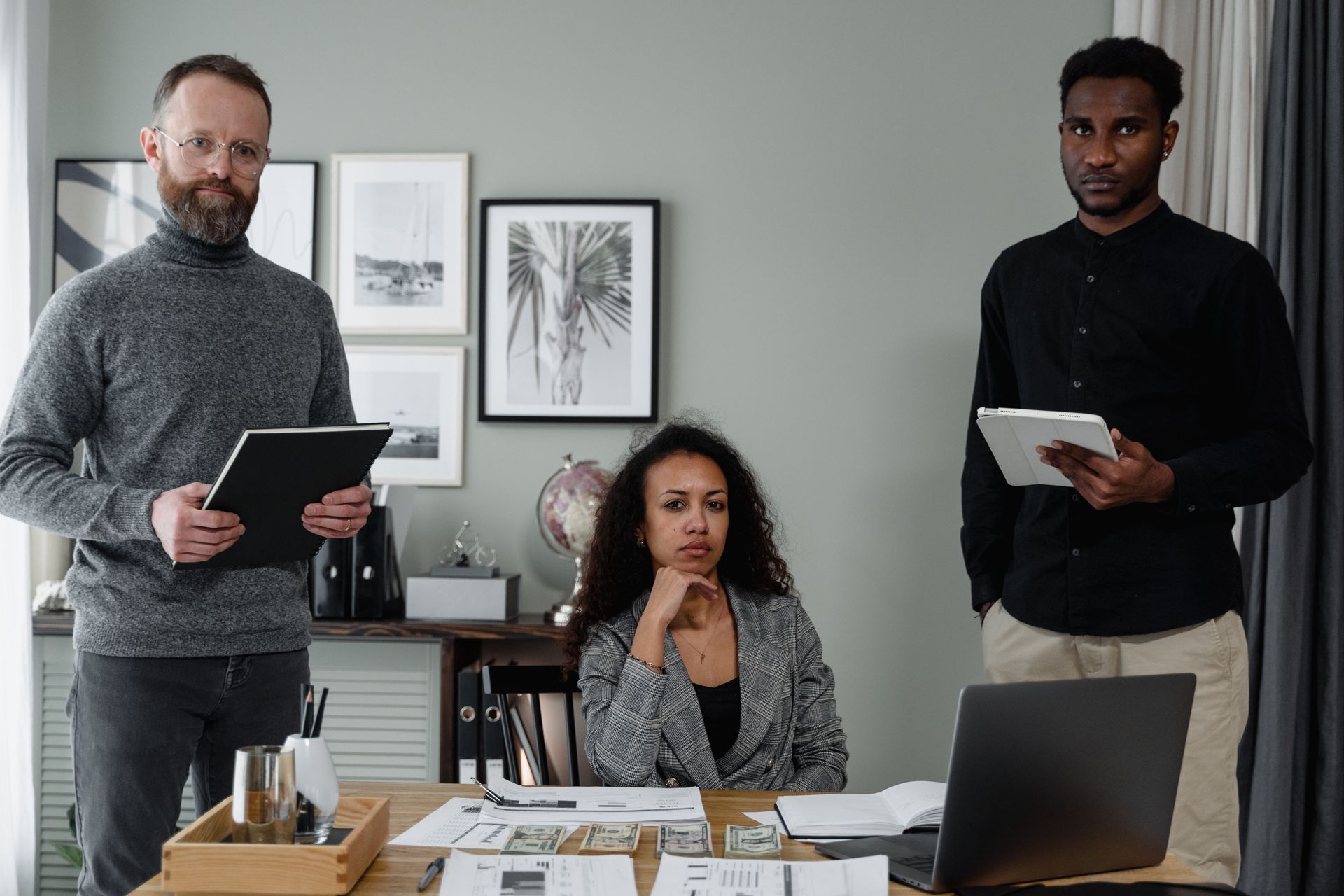 A diverse team of professionals collaborating in a modern office setting, planning and coordinating.