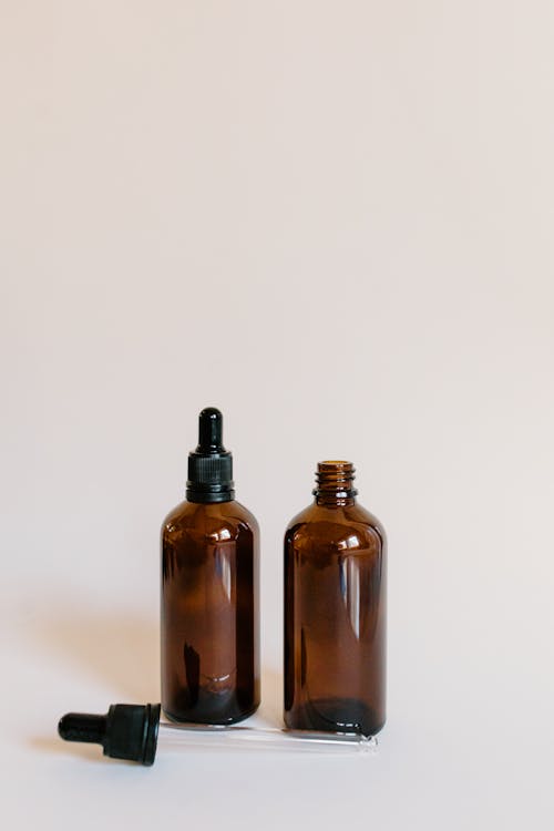 Brown Dropper Bottles on a White Surface