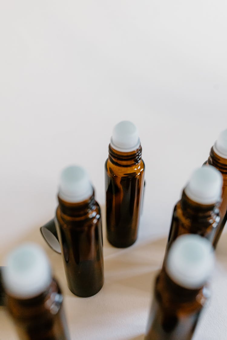 Close-up Photo Of Empty Roller Bottles 