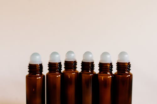 Brown Roller Bottles in Close Up Photography