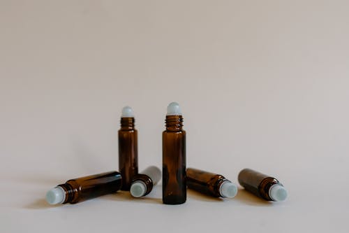 Free Brown Roller Bottles on White Background Stock Photo