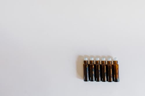 Fotos de stock gratuitas de aceite esencial, aromaterapia, botellas de rodillos