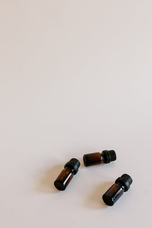 Essential Oil Bottles on White Surface