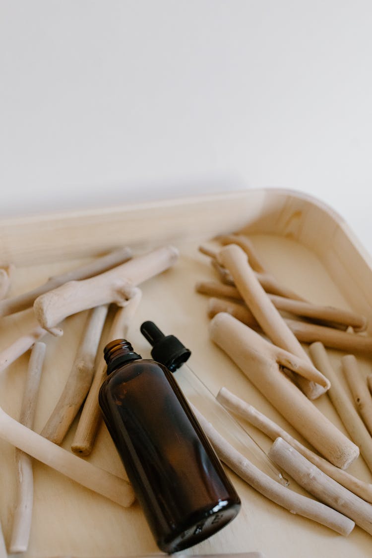 Close-up Photo Of An Empty Amber Bottle With A Dropper 