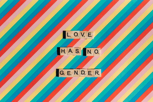 Scrabble Tiles on Rainbow Background