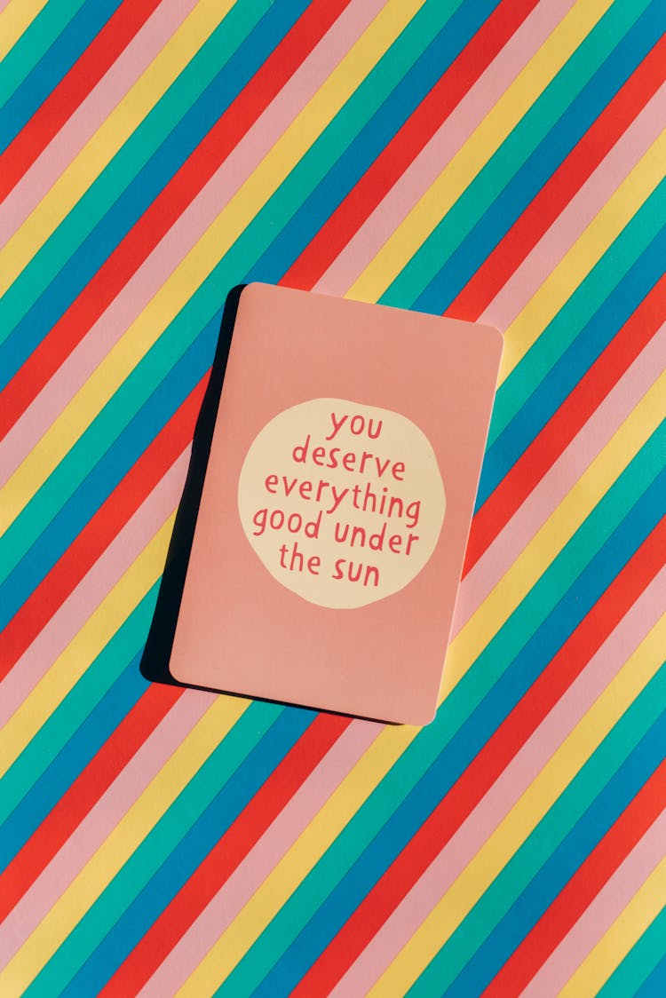 A Card With A Motivation Phrase On Colored Background