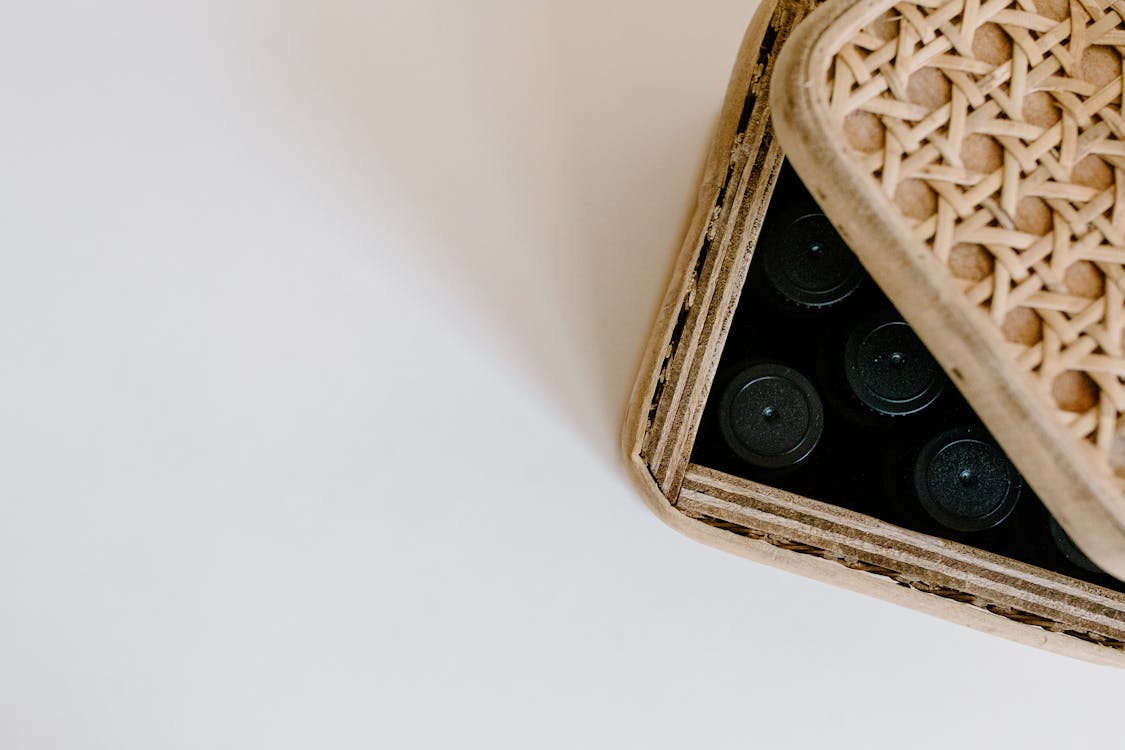 Black Bottle Caps in Brown Basket