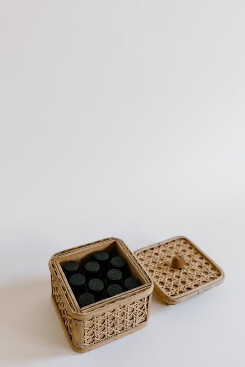 Black Bottles in Brown Basket