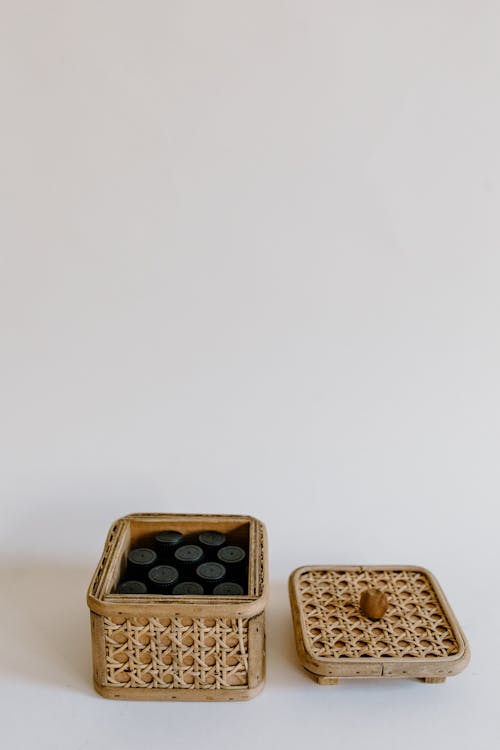 Black Bottle Caps in Brown Basket