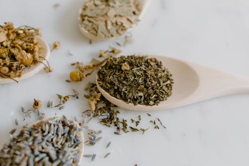 Selective Focus of Herbal Medicine on a Wooden Spoon