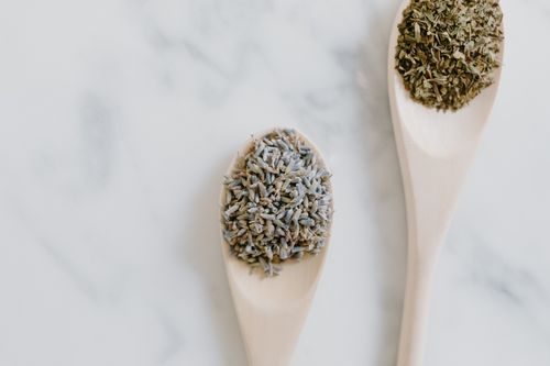 Free Aesthetic close-up of dried lavender and herbs on spoons, perfect for aromatherapy and cooking. Stock Photo