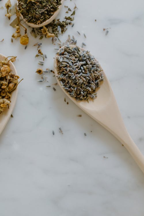 Free Close-Up Shot of Herbal Medicine on a Wooden Spoon Stock Photo