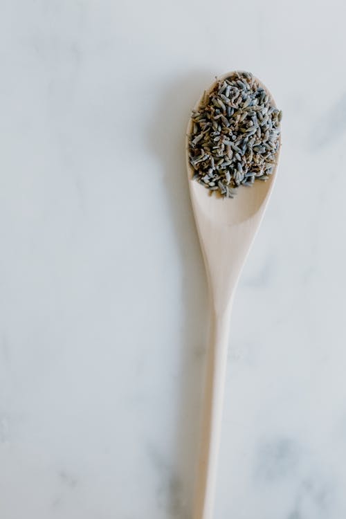 Free Herbal Medicine on a Wooden Spoon Stock Photo