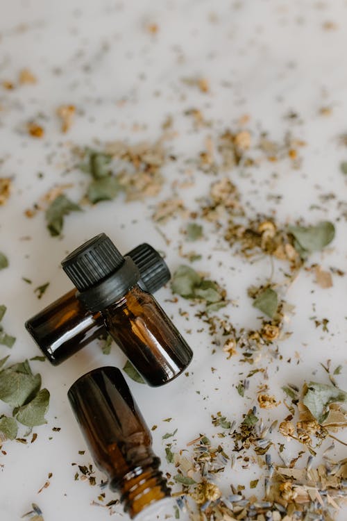 Close-up Photo of Small Amber Bottles 