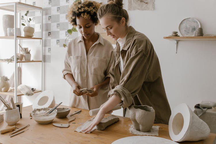 Women Molding A Clay