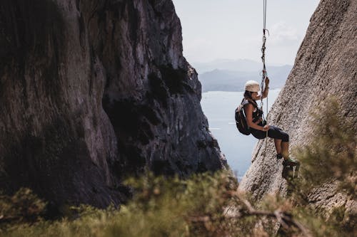 Free A Woman Rappelling with a Rope Stock Photo