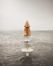 Brown Umbrella on Table Above the Water