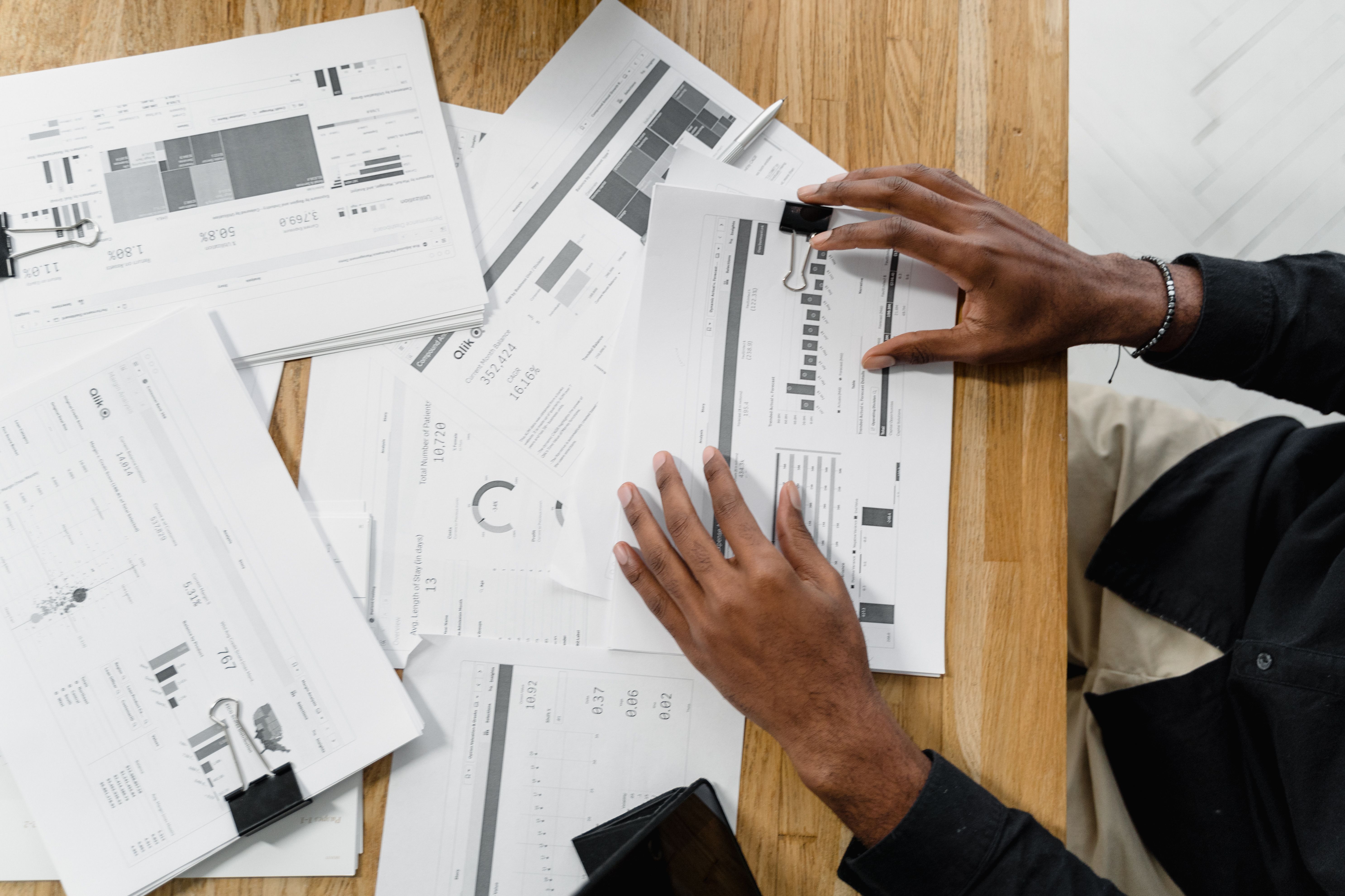 Reviewing payroll and financial documents at a desk