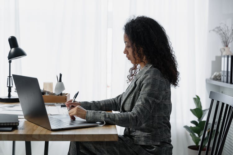 Woman At Her Desk