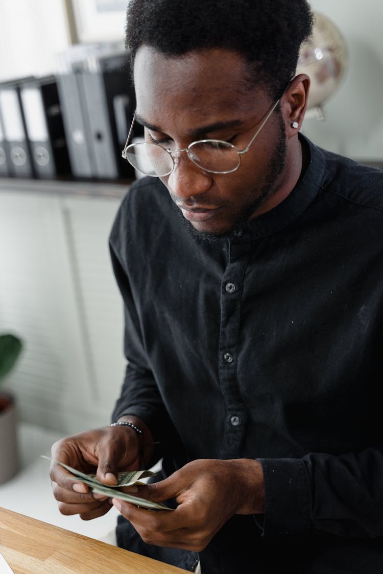 A Man Counting His Money