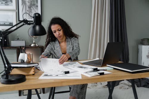 A Businesswoman Working with Papers in the Office
