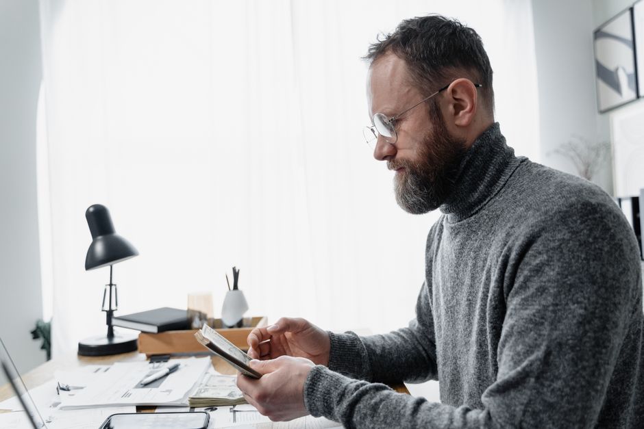 Veteran analyzing franchise opportunities and investment documentation