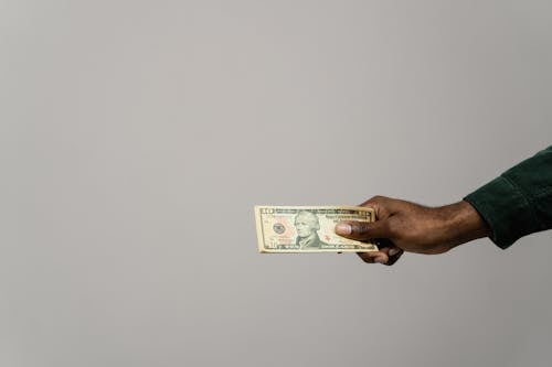Free A Person Holding Cash Money Stock Photo