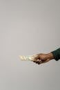 A Person Holding Cash Money