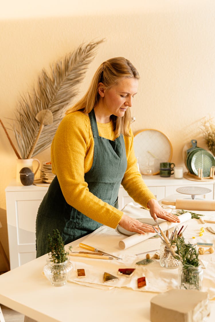 A Woman Using A Rolling Pin 