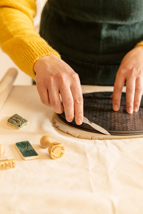 Person Holding Black and Brown Wooden Board