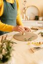 A Woman Stamping a Dough