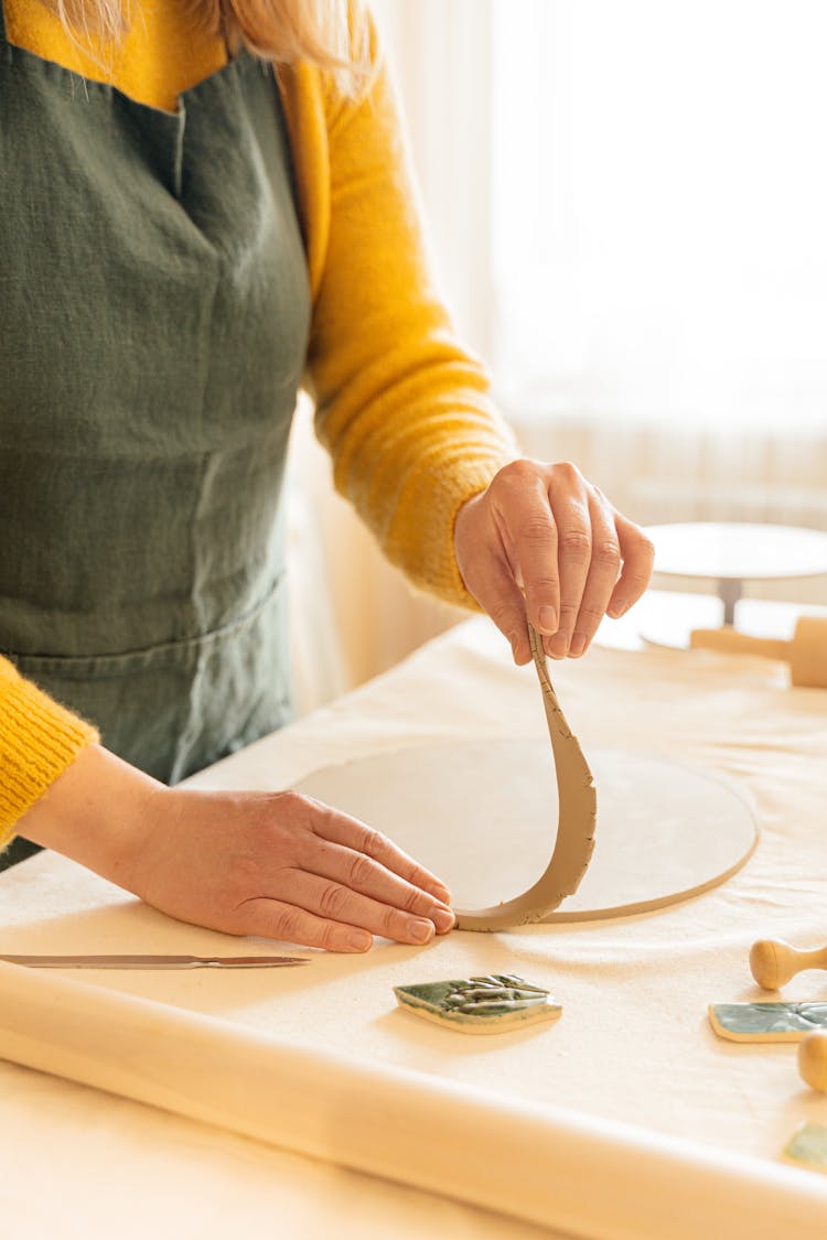 Shaping A Clay Dough Into A Circle