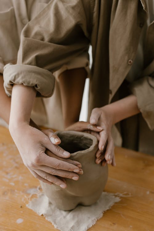 Two People Making a Sculpture 