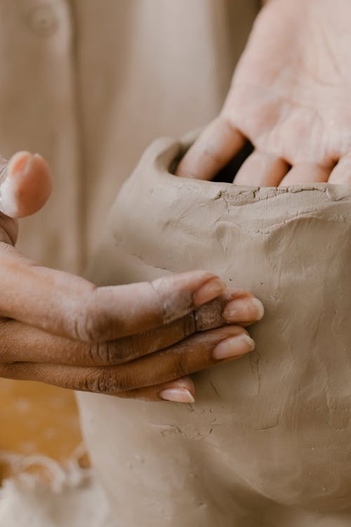 Close-up of Person Sculpting Pottery