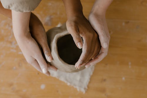 Hands on a Clay Sculpture 