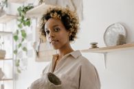 Woman in Brown Shirt Wearing Gold Crown