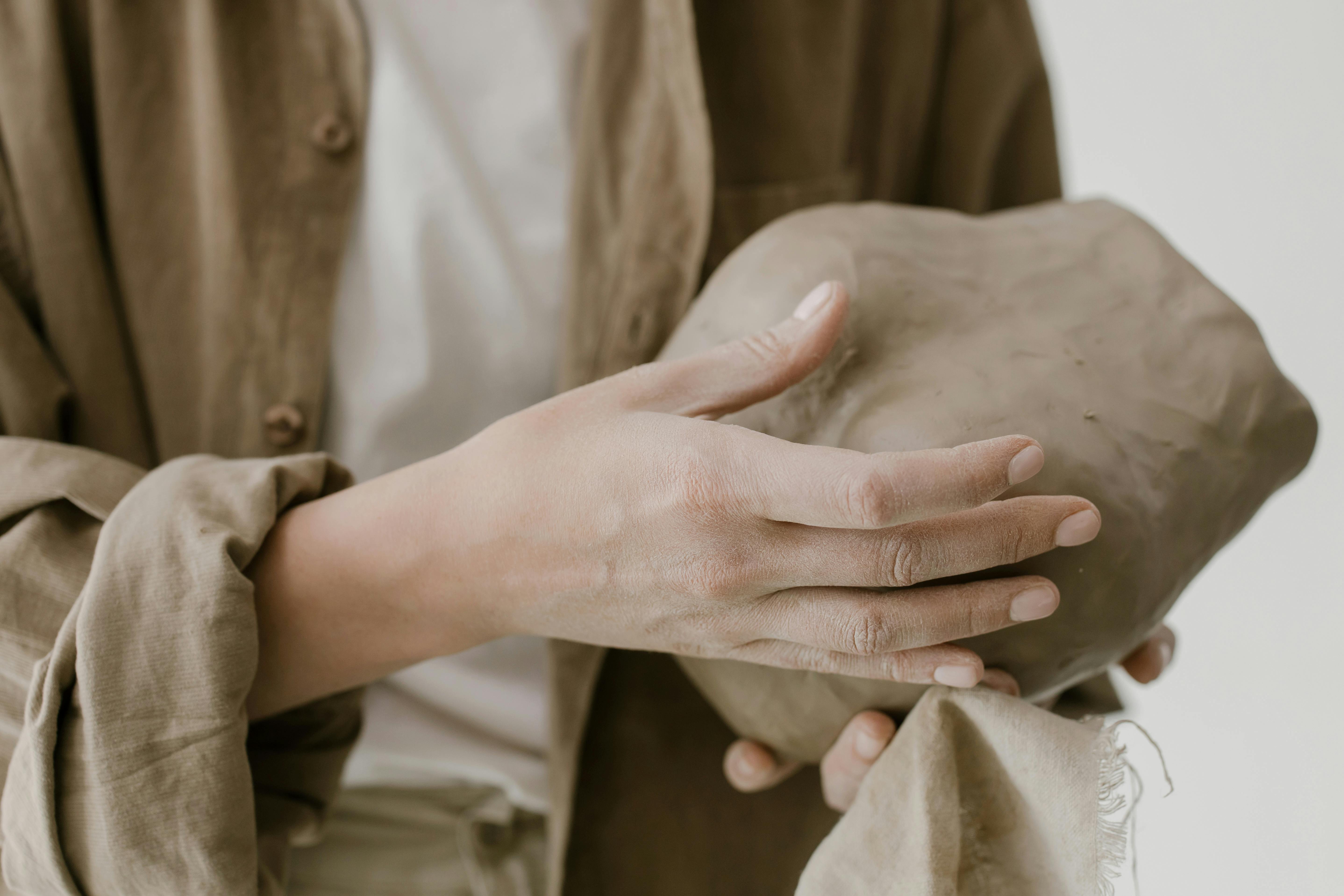 Hands of a Person Sculpting Clay · Free Stock Photo