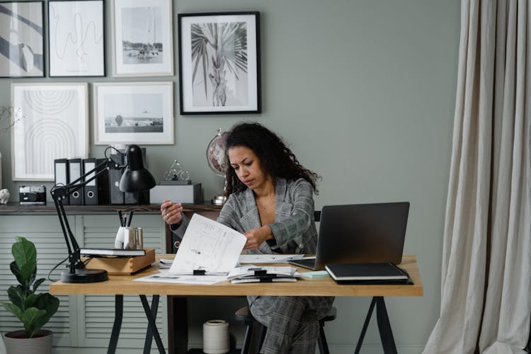 A Woman Working On Her Desk