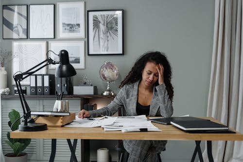 A Woman Working hard in the Office