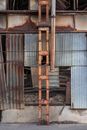 A Steel Pipe and Tower Near a Chain Link Fence